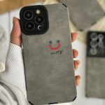 قاب موبایل آیفون چرم و جیر طوسی اسمایل محافظ لنزدار