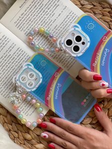 قاب موبایل آیفون آسمان آبی و رنگین کمان هلوگرامی + آویز خرسی - تصویر 2