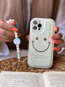 قاب موبایل آیفون هپی فیس بالشتی + بندست - تصویر 2