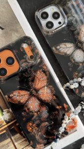 قاب موبایل آیفون پروانه ترنسپرنت مشکی پولکی طلایی - تصویر 2