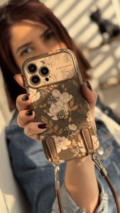 قاب موبایل آیفون گل فلاور کرم فندقی + بند چرمی ست