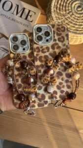 قاب موبایل آیفون چشم پلنگی شاینی + بندست - تصویر 2